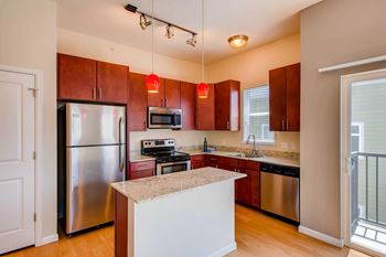Gourmet kitchens with granite countertops and stainless steel appliances